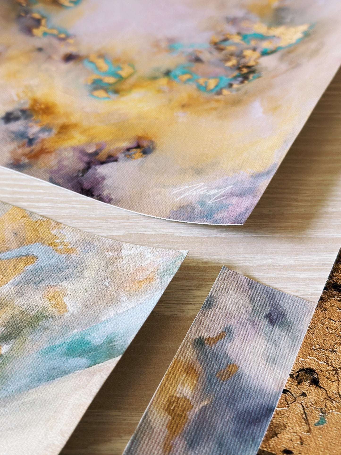 Gold abstract art with pops of teal