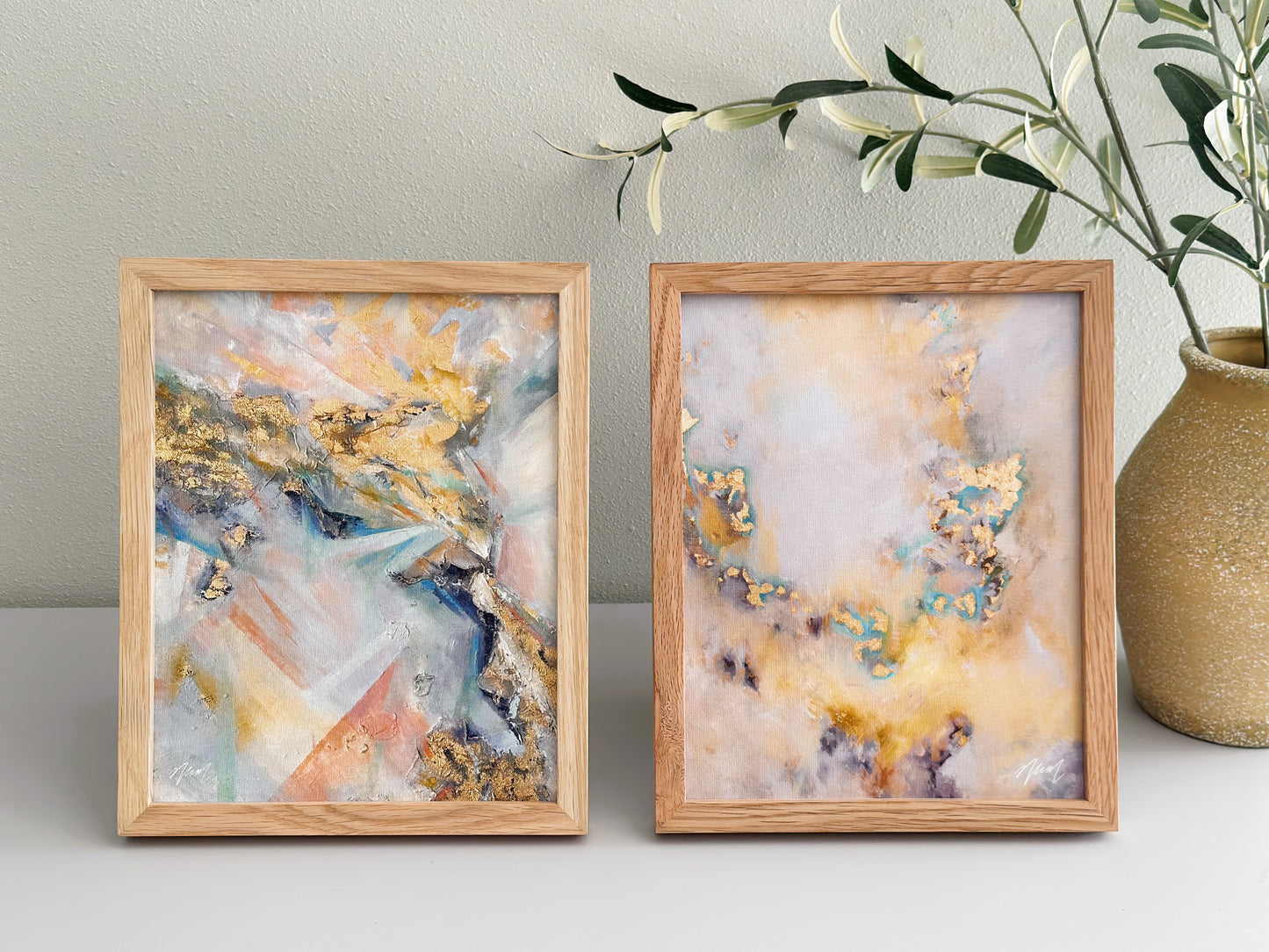 Gold abstract art with pops of teal